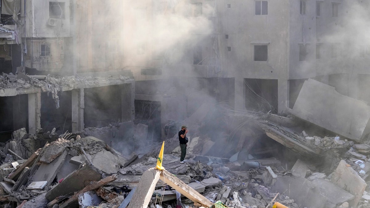 Smoke on top of rubble