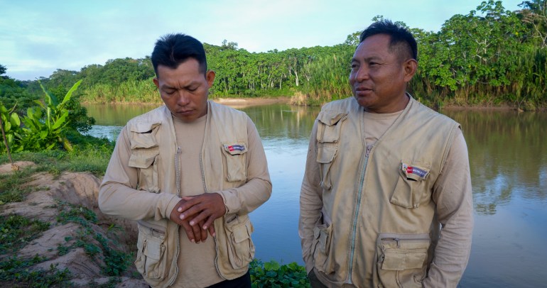 Fredy Capitan (left) and Nolasco Torres in their village of Balta. As government protection agents, they monitor the remote jungle for signs of isolated tribes [Neil Giardino/Al Jazeera]