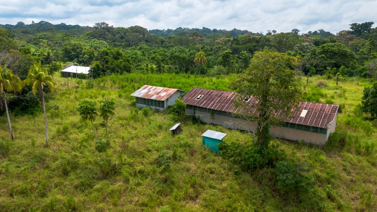 Following a deadly raid by an isolated tribe in 2020, villagers in the Huni Kuin community of Santa Rey fled. It remains abandoned today [Neil Giardino/Al Jazeera]