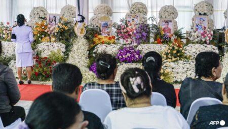 Flowers and toys at funeral for Thai school bus fire victims