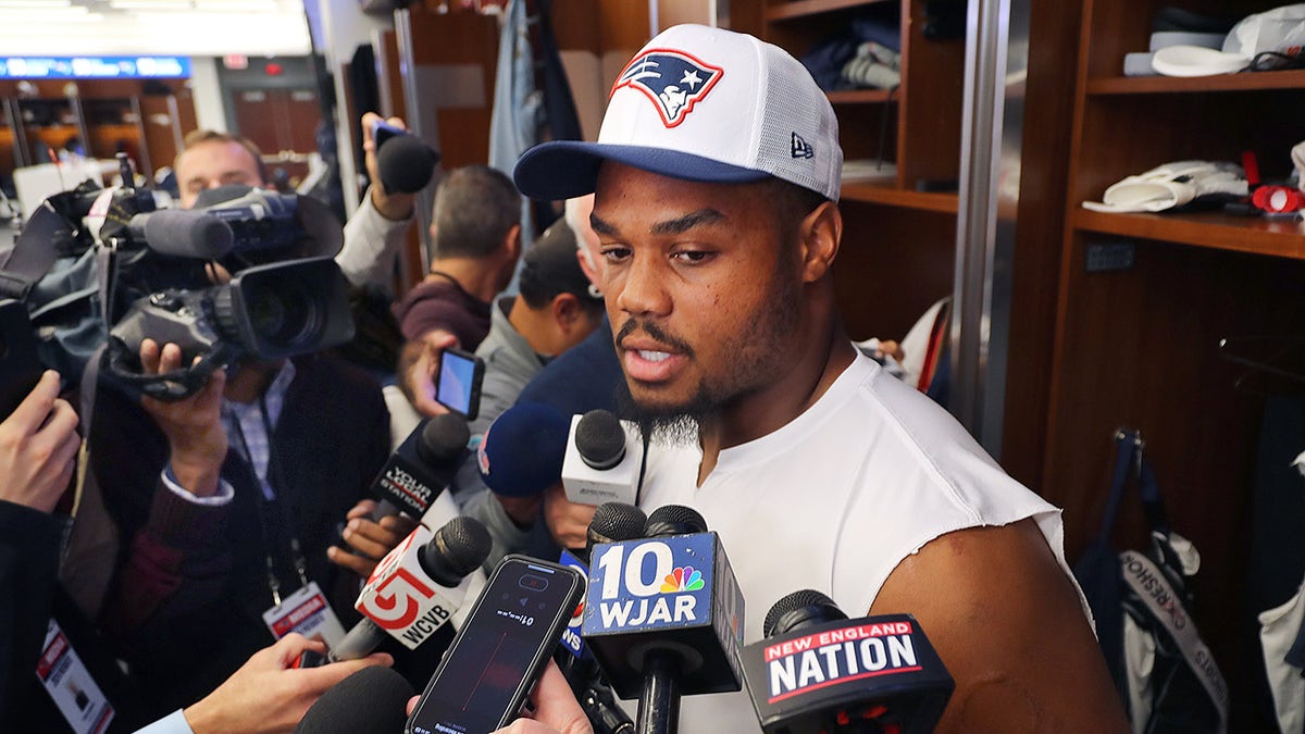 New England Patriots center Nick Leverett talks to media