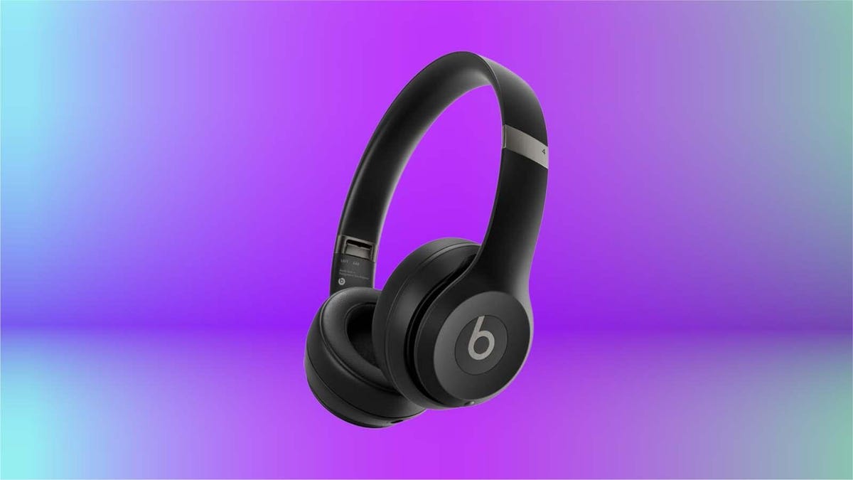 Beats Solo 4 headphones on purple/blue background