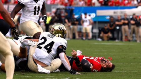 NC State quarterback Grayson McCall carted off the field after scary hit sends helmet flying