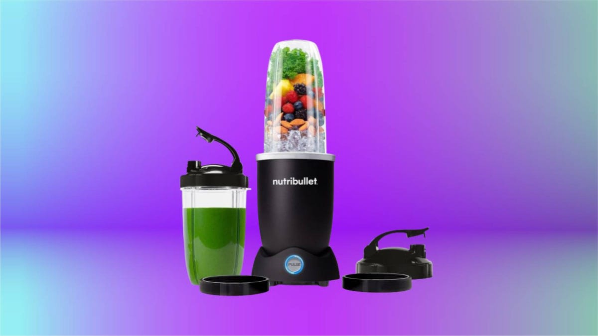 Nutribullet Pro personal blender against a gradient purple background.