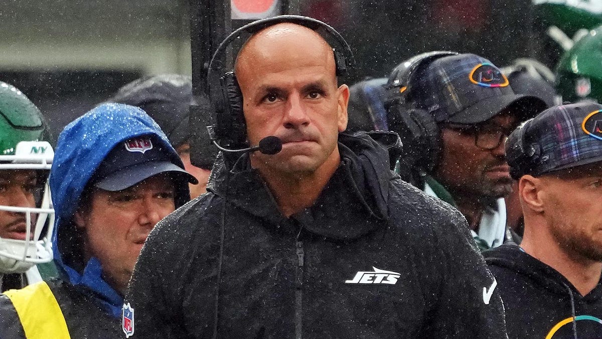 Robert Saleh looks on