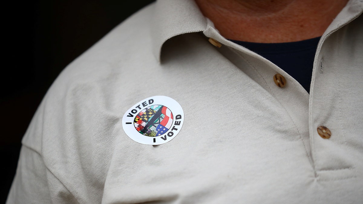 man with I Voted sticker on 