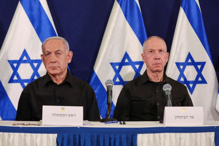 FILE PHOTO: Israeli prime minister Benjamin Netanyahu and defense minister Yoav Gallant during a press conference in the Kirya military base in Tel Aviv , Israel , 28 October 2023. ABIR SULTAN POOL/Pool via REUTERS/File Photo