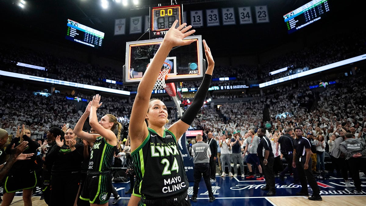 Napheesa Collier waves to the crowd