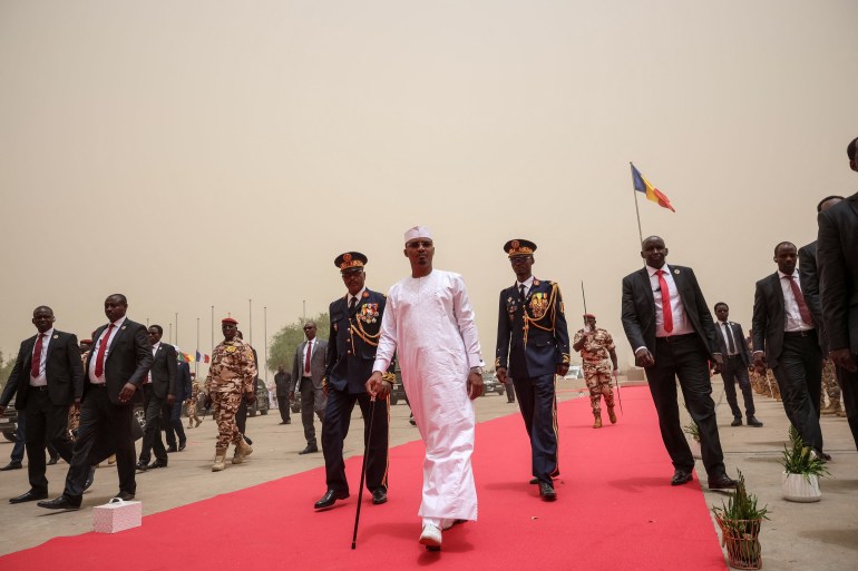 Chad President-elect General Mahamat Idriss Deby Itno (C) arrives for his inauguration at the Palace of Arts and Culture in N'Djamena