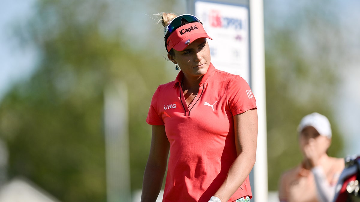 Lexi Thompson walks on golf course