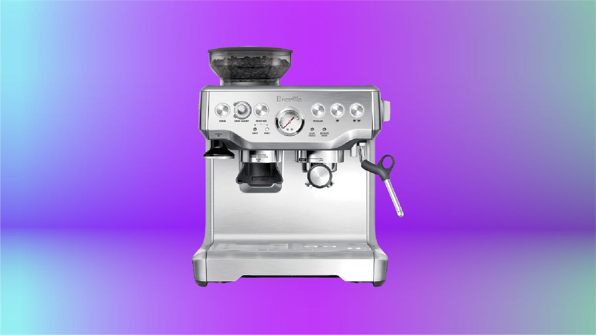 Silver Breville coffee maker against purple gradient background.