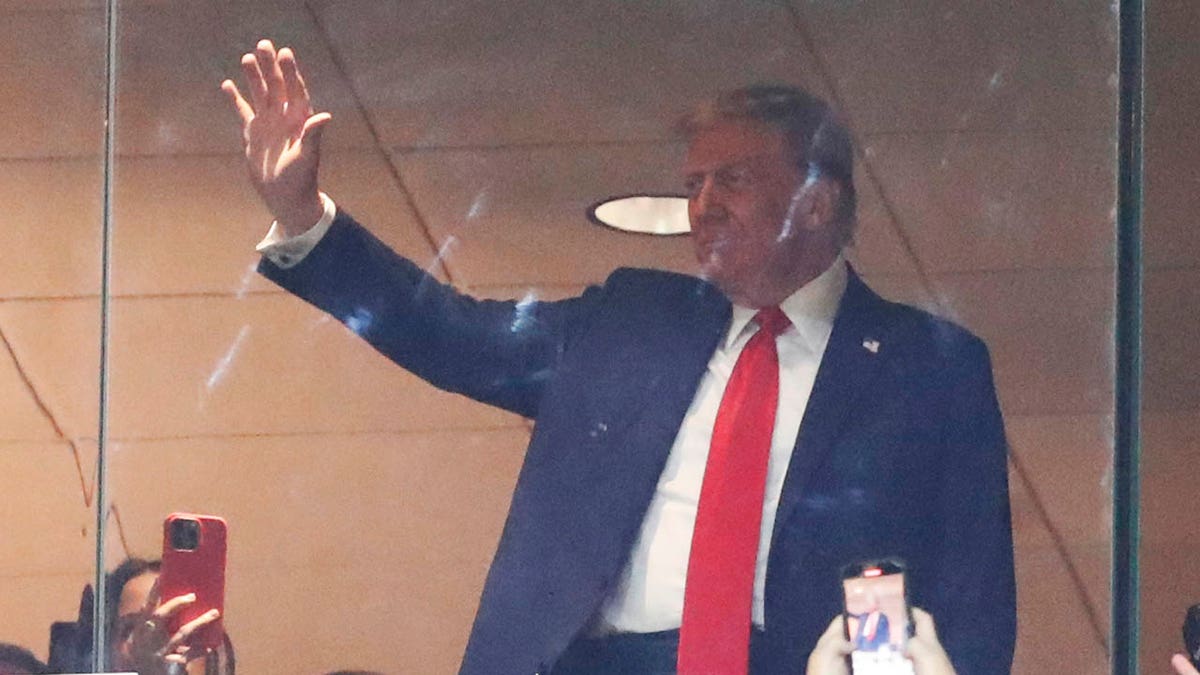 Donald Trump waves to crowd at Steelers game