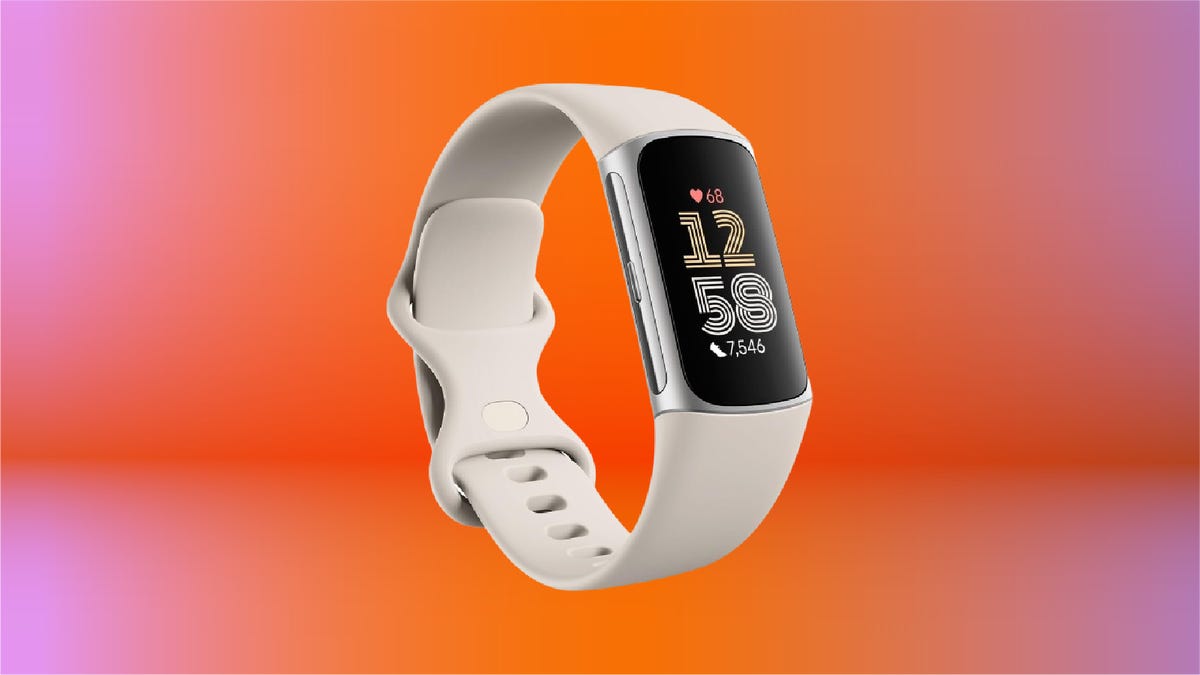 The Fitbit Charge 6 on display on an orange gradient background.