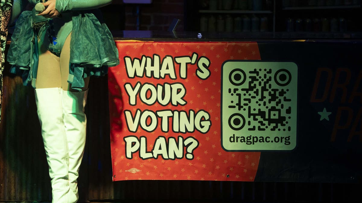 A sign is seen during a Tucson-area rally organized by Act! With Pride Tucson and sponsored by Drag PAC.