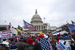 Man Charged With Using Large ‘Trump’ Sign as Weapon During Jan. 6 Riot