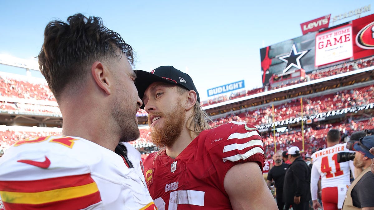 Travis Kelce and George Kittle interact