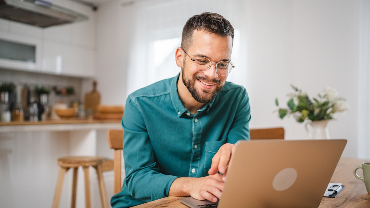 A man on a computer