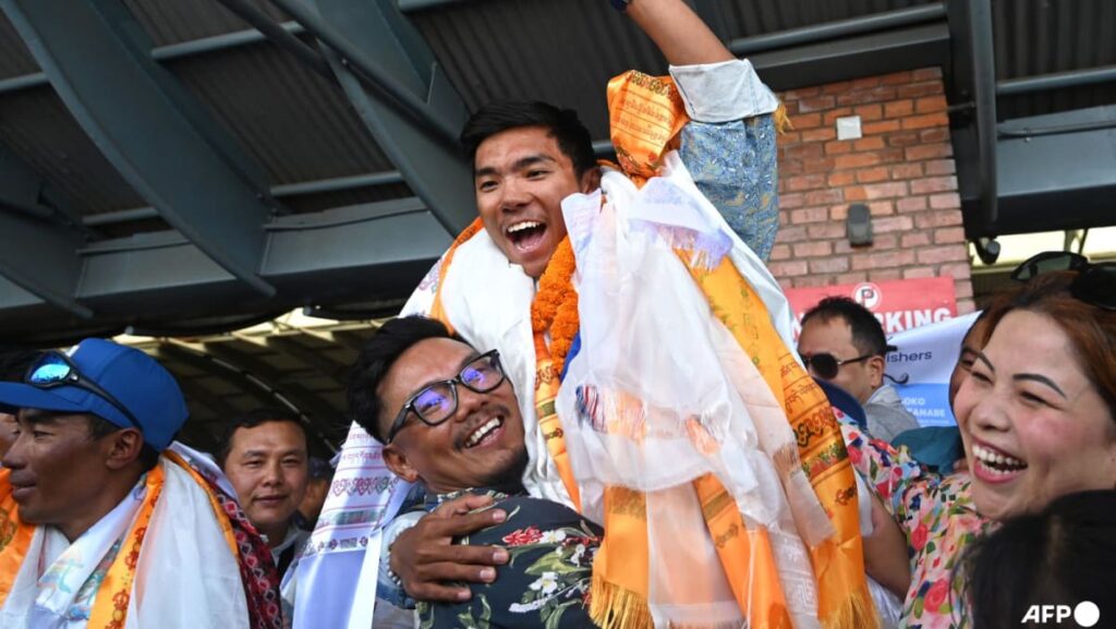 Nepali teenager hailed as hero after climbing world’s 8,000m peaks