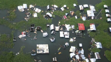 Philippine rescuers battle floodwaters to reach stranded