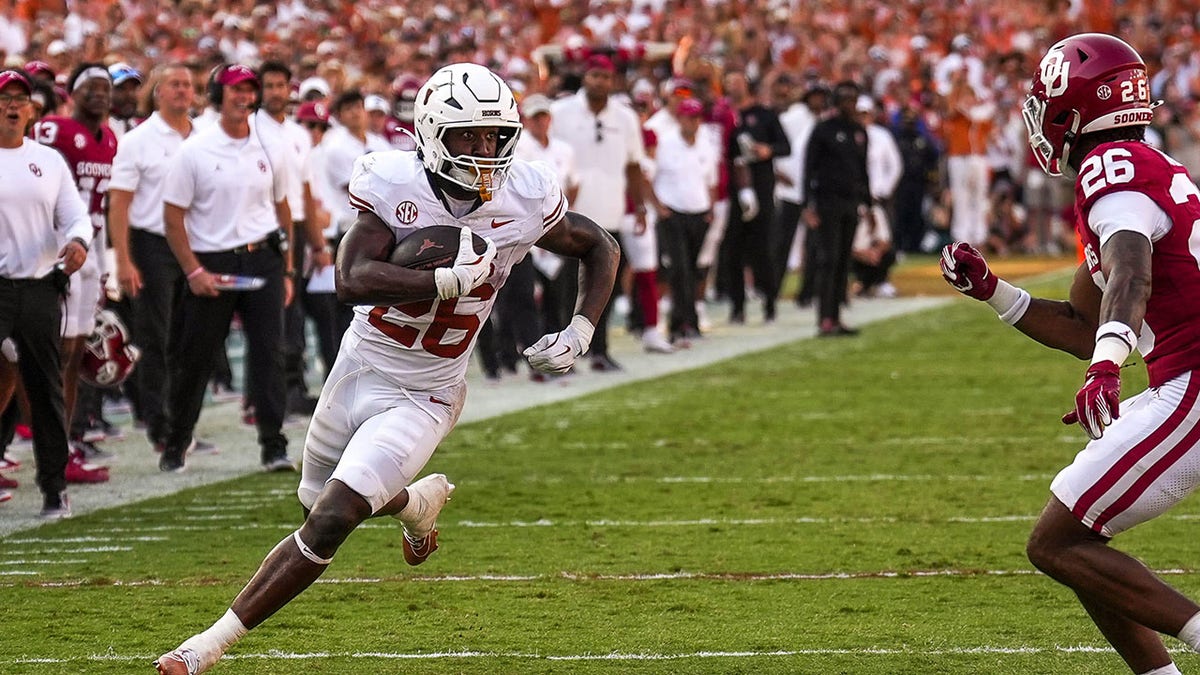 Texas Longhorns player runs with the football