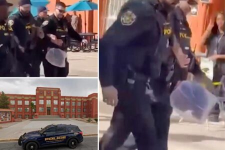 High school student carted off by cops with ‘spit mask’ on his head after allegedly attacking female classmates: video