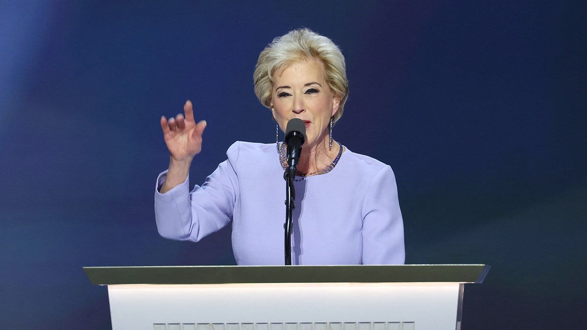 Linda McMahon wearing purple