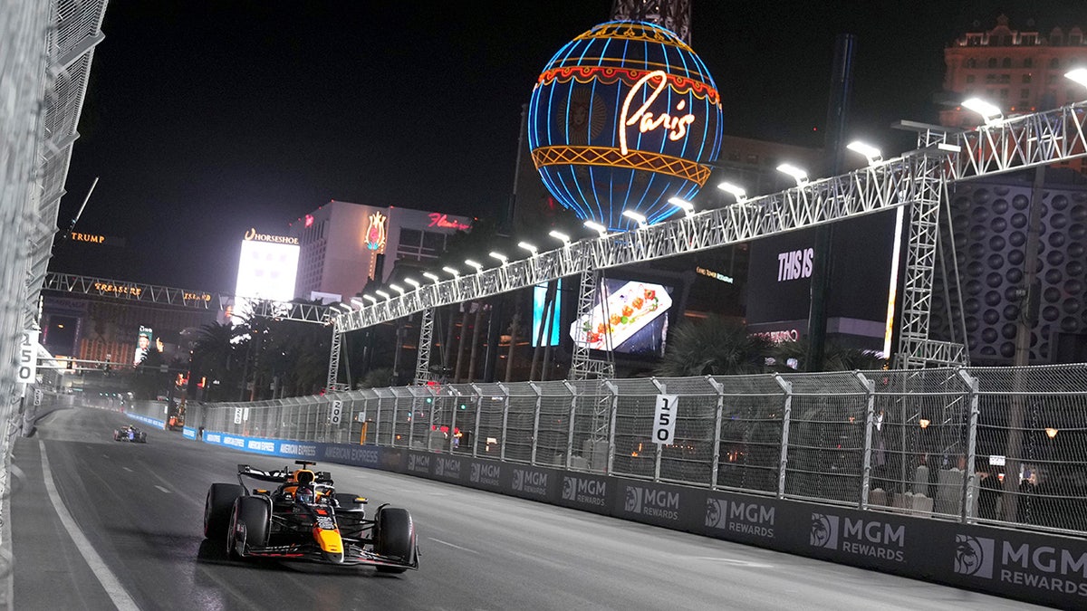 Max Verstappen drives past Paris