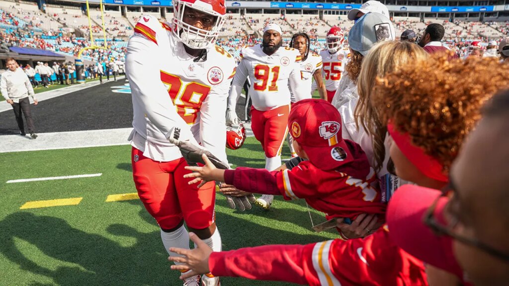 Chiefs lineman Tershawn Wharton catches young fan after falling over barrier at Panthers’ stadium