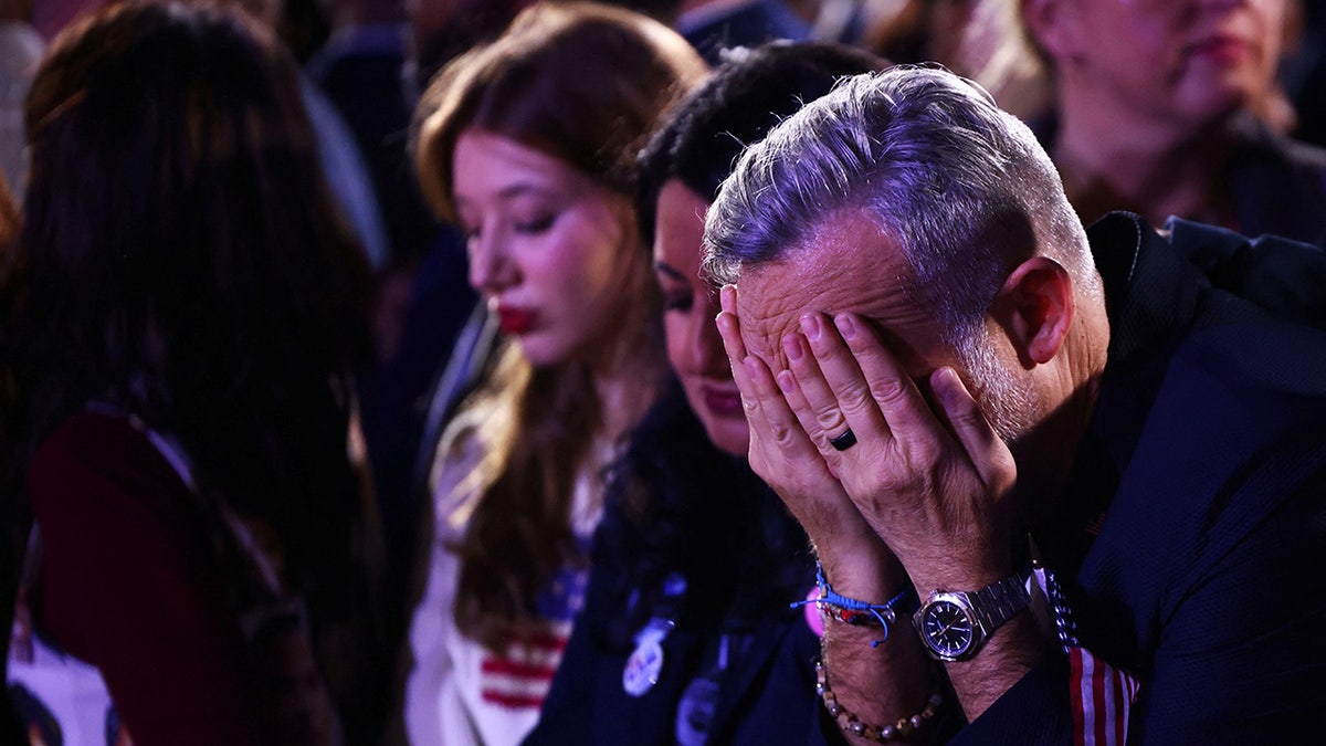 Harris supporter with head in hands