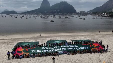 Troops, armoured cars protect G20 summit, as favelas champion solar