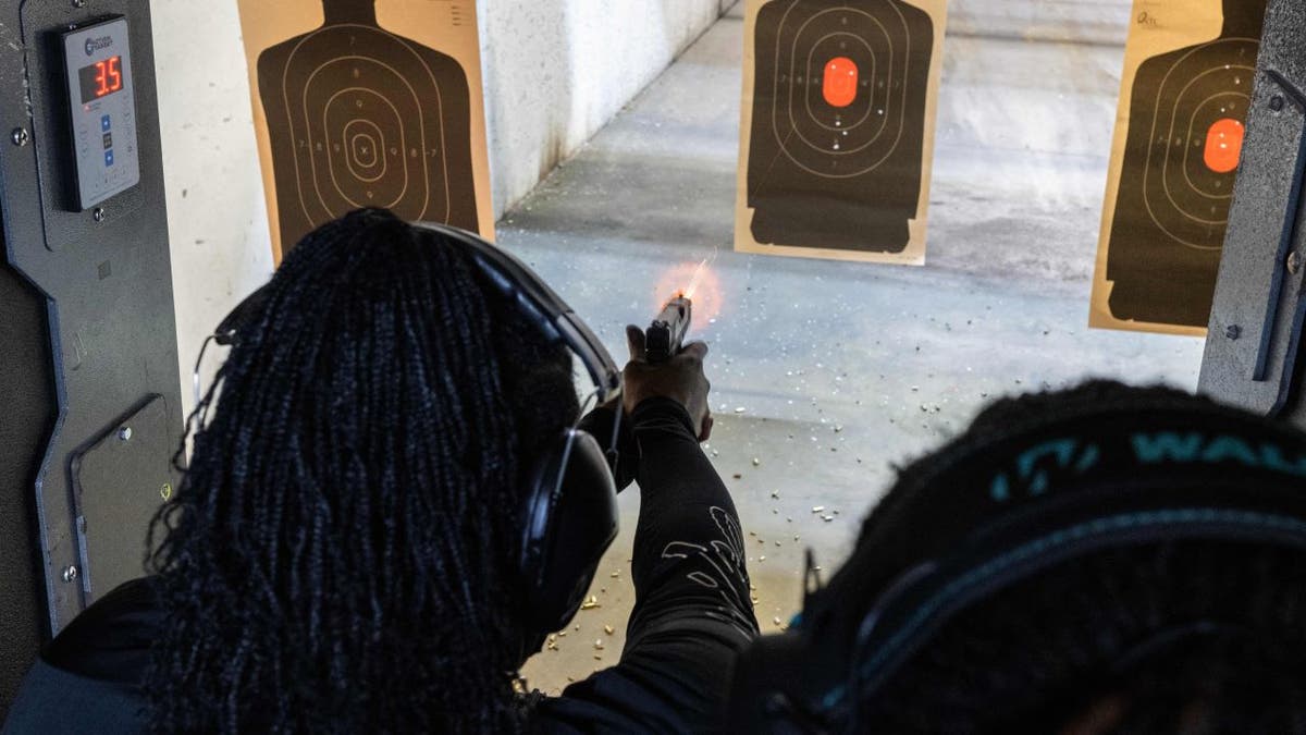 Woman shooting gun