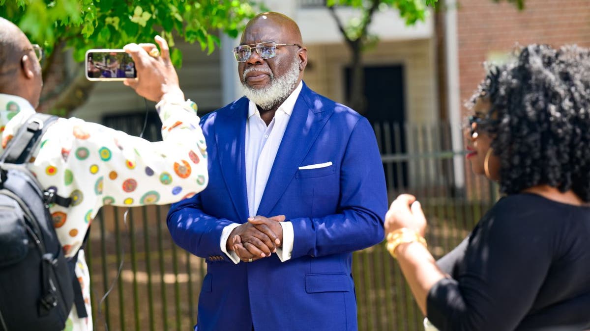 TD Jakes standing outside