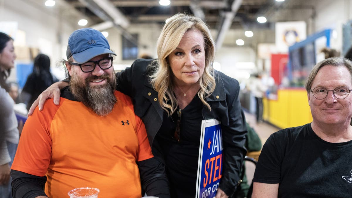 Stelson posing with supporters on campaign trail