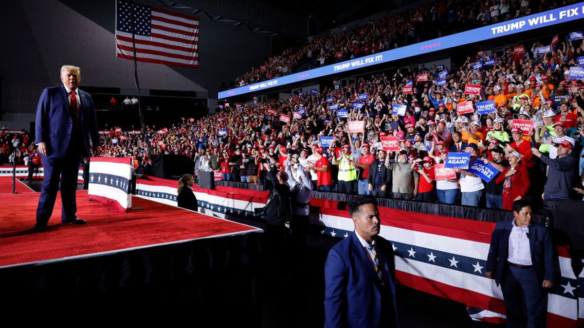 GRAND RAPIDS, MICHIGAN - NOVEMBER 05: Republican presidential nominee, former President Donald Trump takes the stage for a campaign rally at Van Andel Arena on November 05, 2024 in Grand Rapids, Michigan. Trump campaigned for re-election in the battleground states of North Carolina and Pennsylvania before arriving for his last rally minutes after midnight in Michigan. (Photo by Chip Somodevilla/Getty Images)