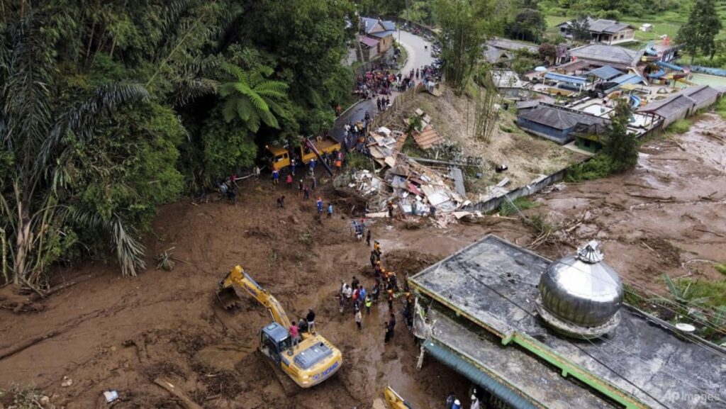 Indonesia digs out as flooding, landslide death toll hits 20