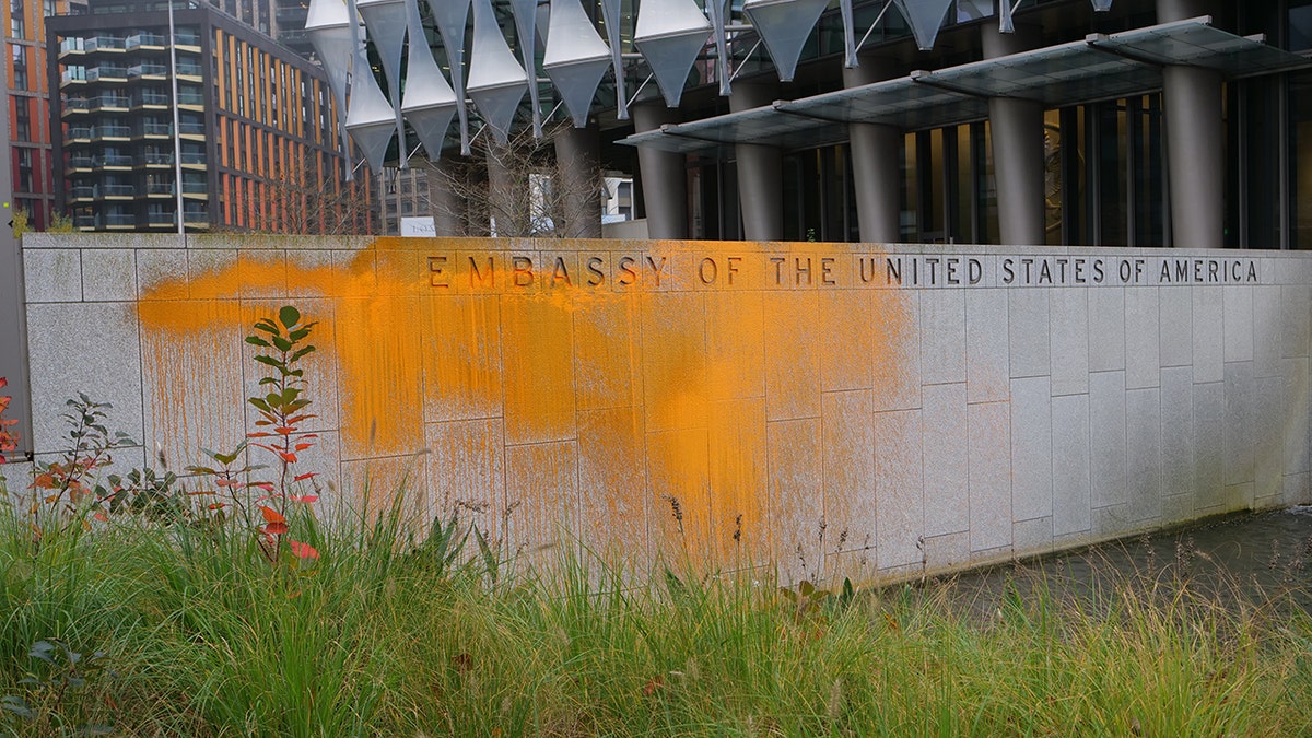 U.S. embassy in London exterior wall covered in orange paint