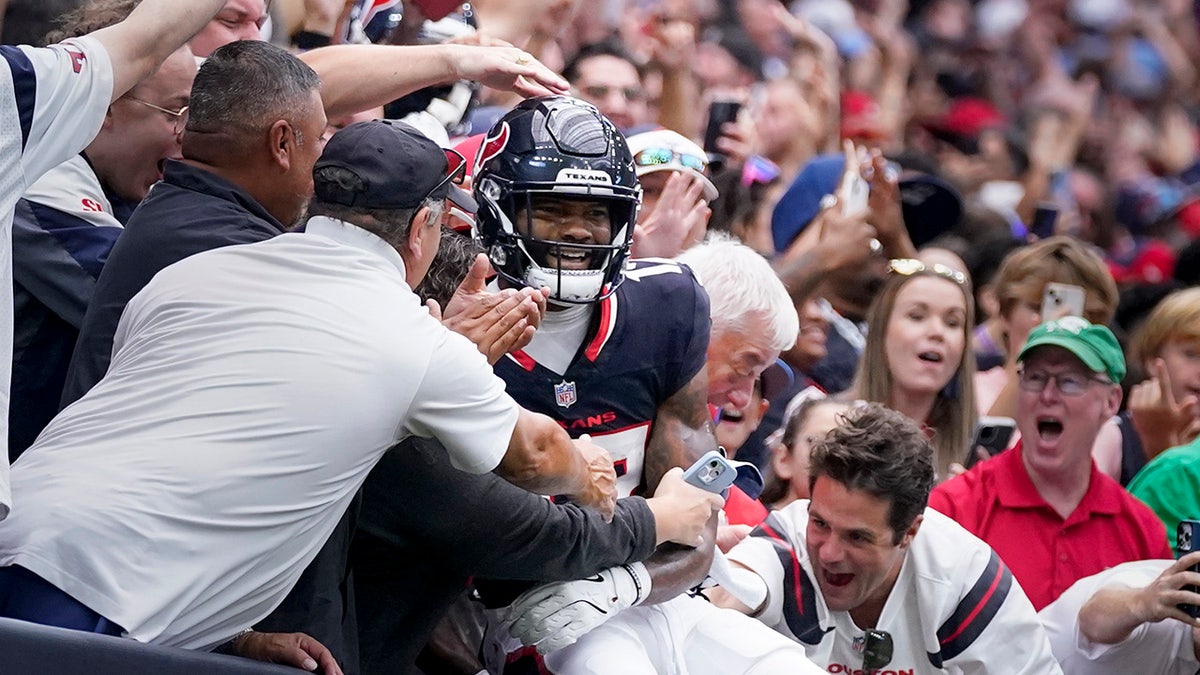 Nico Collins celebrates