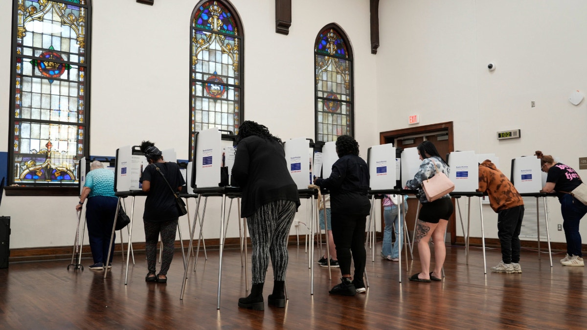 Voters casting ballots 