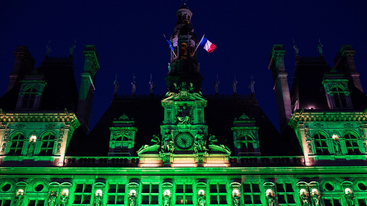 Paris City Hall is lit up in green to mark the disapprobation of the French capital and its socialist mayor, Anne Hidalgo, against the decision of then-President Trump to withdraw from the climate agreement made in Paris.