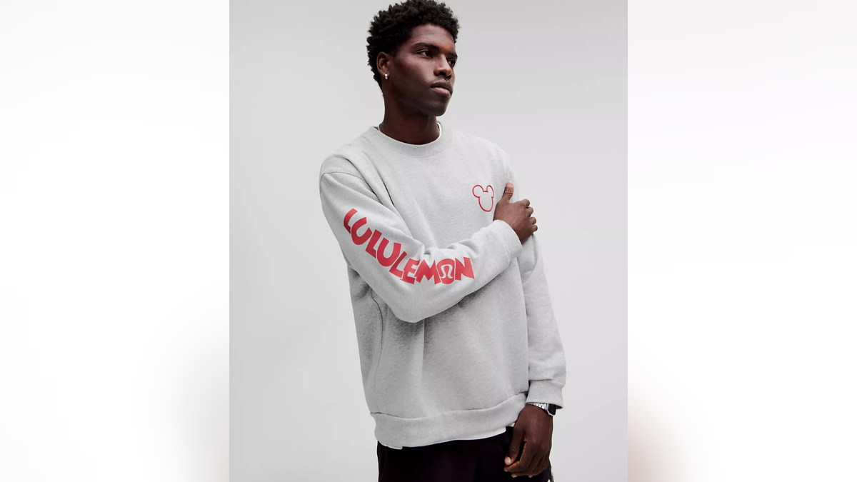 A trendy, comfortable crew neck featuring a small Mickey outline. 