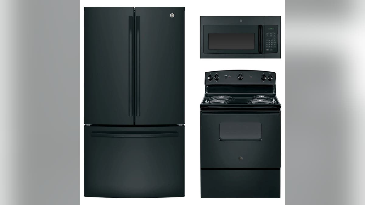 This all-black appliance set includes a range, refrigerator and microwave.