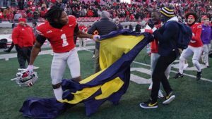 Michigan’s shocking upset over Ohio State erupts into chaos as massive brawl breaks out at midfield