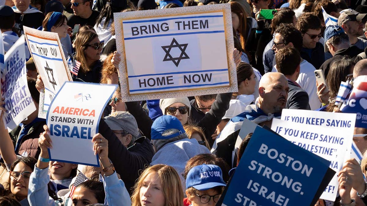 A pro-Israel supporter holds a sign during the March for Israel on the National Mall in Washington on Nov. 14, 2023.