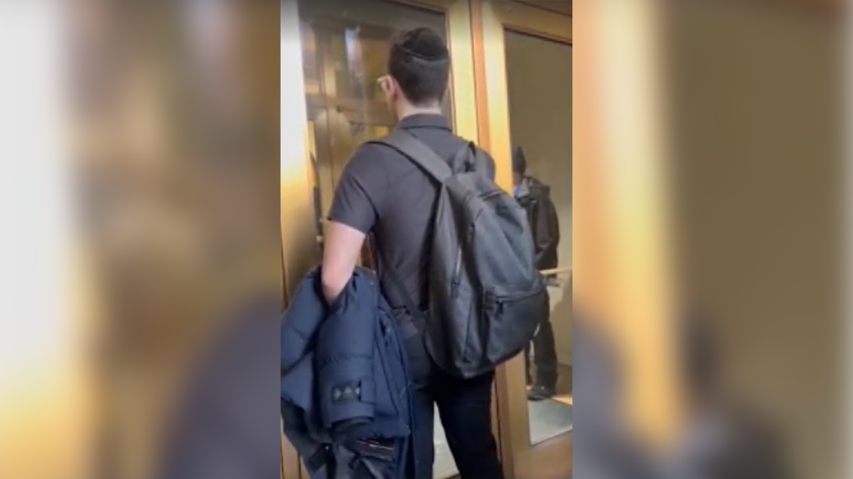 Students try to enter the door of a building at Barnard College in New York City