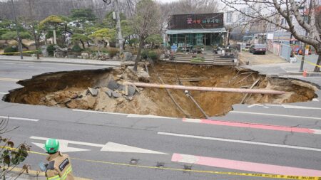 Motorcyclist who vanished into sinkhole is found dead following search