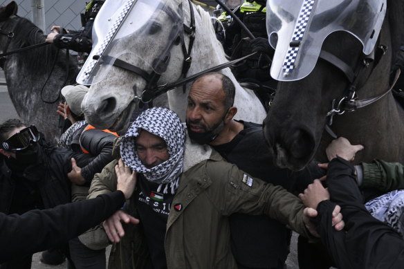 Ihab Al Azhari (centre, without keffiyeh) at the Land Forces Expo protest last September.