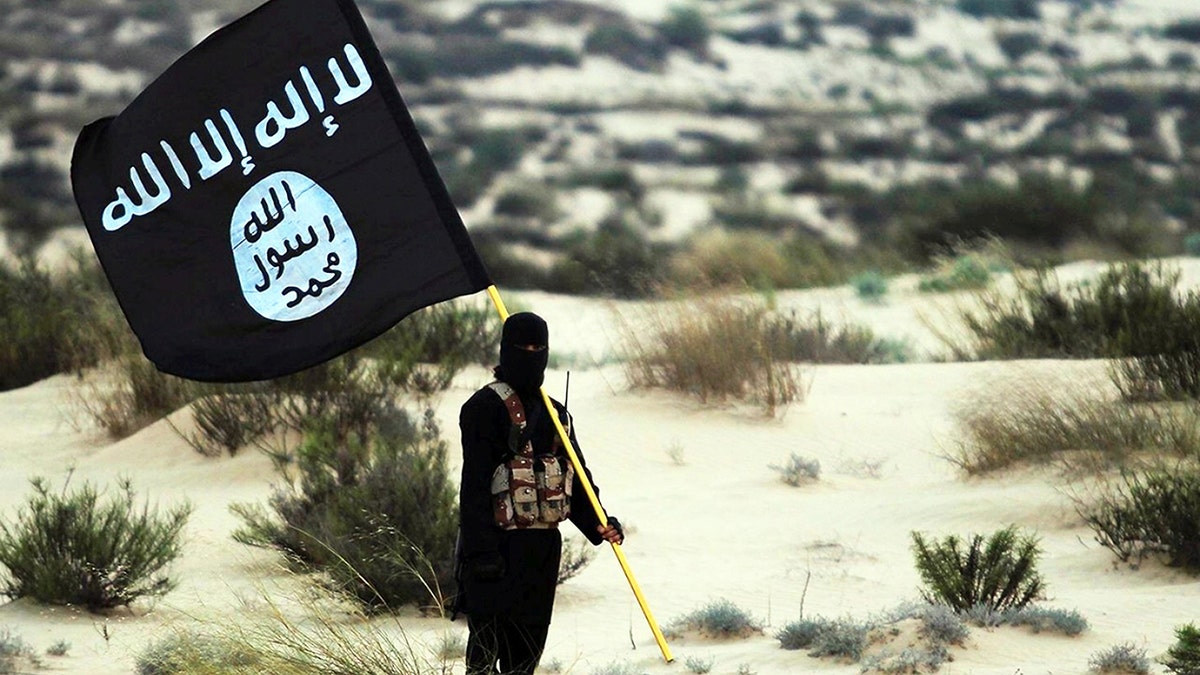 ISIS soldier holding a flag