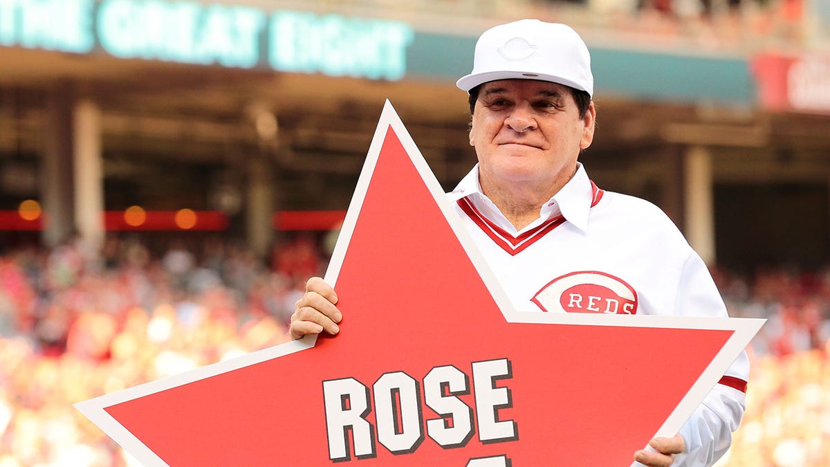 Pete Rose poses with retired number