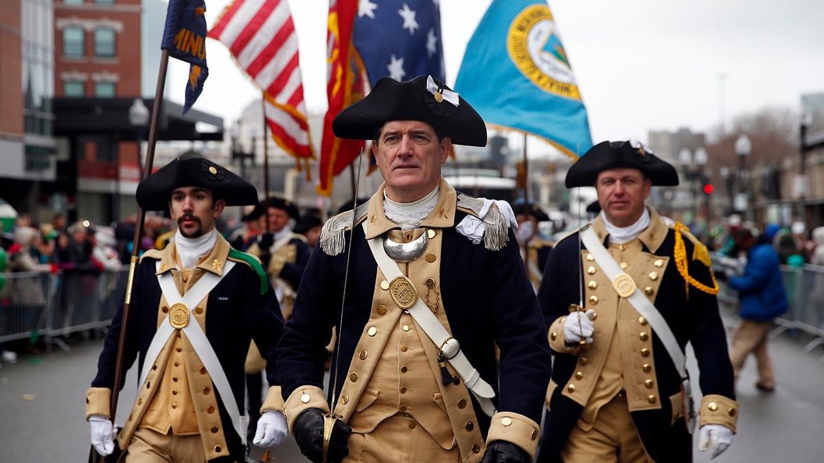 Lexington Minutemen march in past St. Patrick's Day Parade in Boston