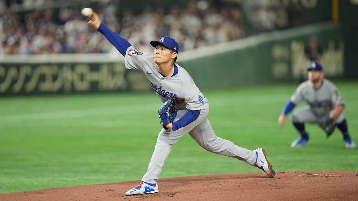 Yoshinobu Yamamoto throws pitch